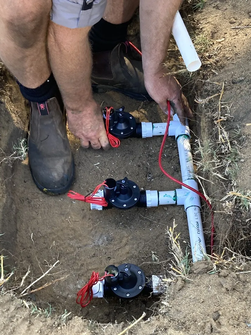 Technician repairing a reticulation solenoid valve in Perth